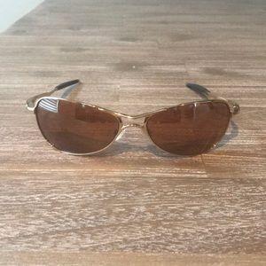 Men’s Gold Oakley sunglasses